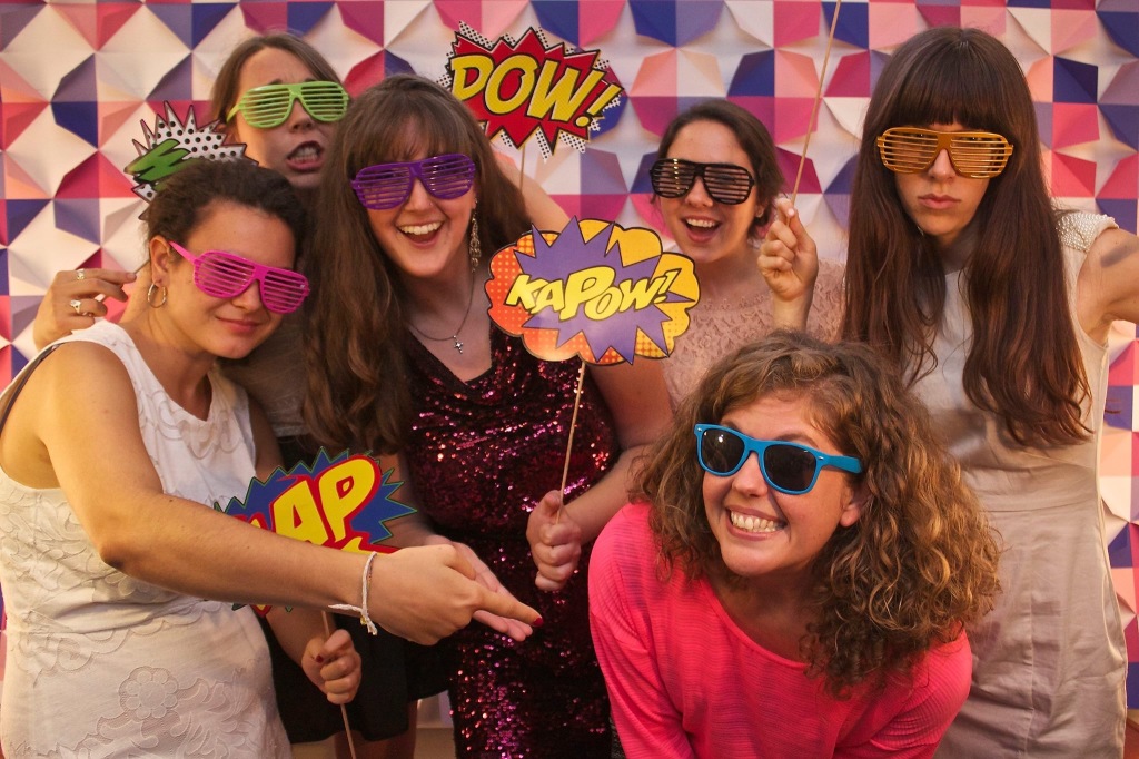 Globalscope campus minister Beth Silliman, in front in pink, and her good friend Laura, at left in white, pose with other friends from Unterwegs at the ministry’s end-of-the-year awards show in Tübingen, Germany.