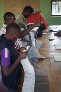 New beekeepers sew their protective veiled hats during Mike Noel's class.