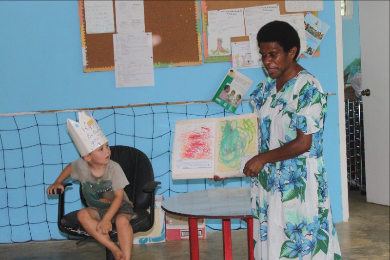 Elijah and his teacher at his school celebration of his birthday